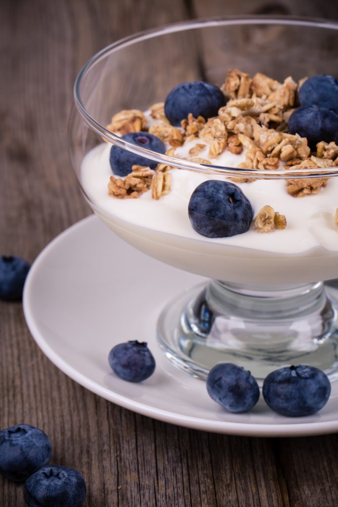 Yogurt with granola and fresh blueberries