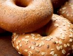 A close up of multigrain and seeded bagels