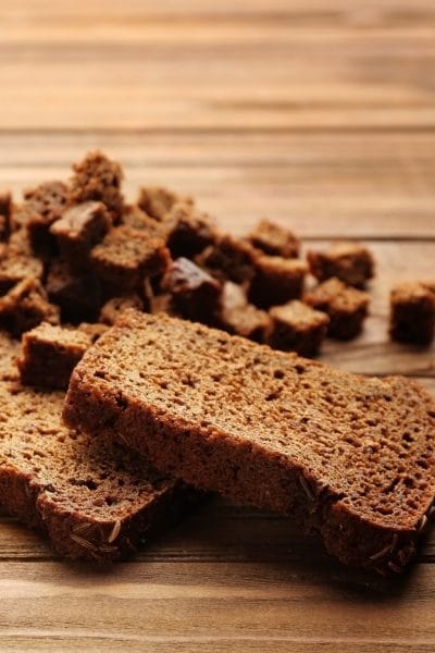 A couple of slices of rye bread and cubed pieces