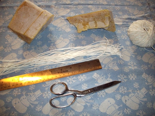 Candle dipping ingredients - beeswax, wicking, scissors and ruler.