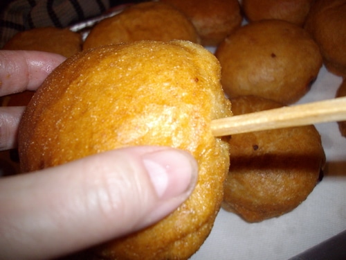 Jelly doughnuts filling with chopstick