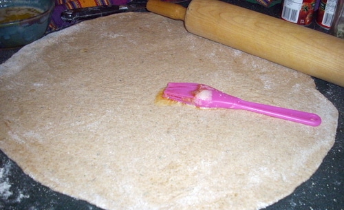 Pizza Twist Bread spreading garlic butter