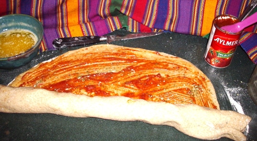 Pizza Twist Bread spreading tomato paste