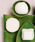 White cheese on green decorative plates