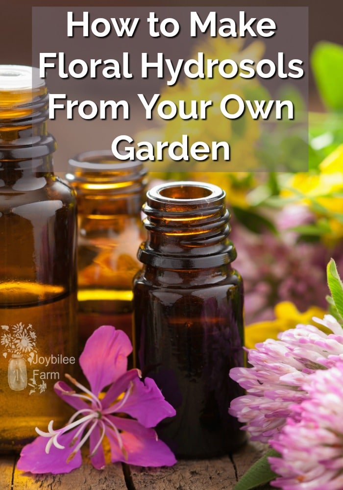 Essential oil bottles and a variety of fresh flowers