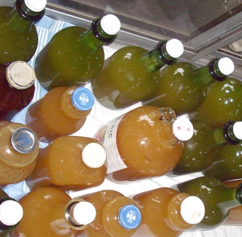 Various bottles containing Apple cider