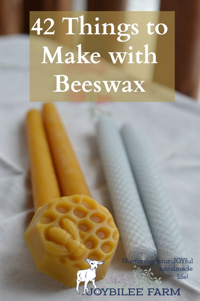 a beeswax block and candles on a white background