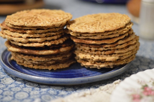 Pizzelles are an Italian wafer cookie made with a special iron press that squishes the cookie batter between two decorative plates, and then heats it to a crisp cookie texture, much like a waffle cone. Pizzelles are quick to make, and not too sweet. Commonly served with espresso they are a light treat that won’t overwhelm.