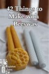 beeswax candles and prepared wax on a white tablecloth background