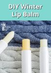 lip balms sitting on a blue and white woolen background