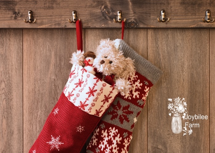 teddy in a stocking on a wooden background, stocking stuffers for women can be cute