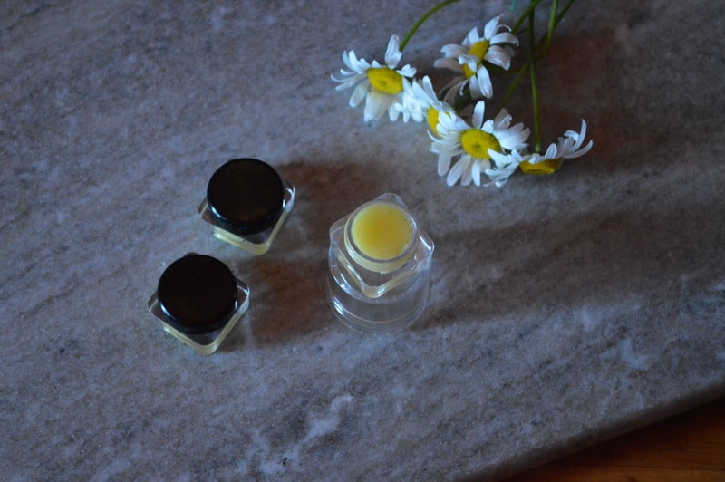 homemade solid perfume in plastic containers