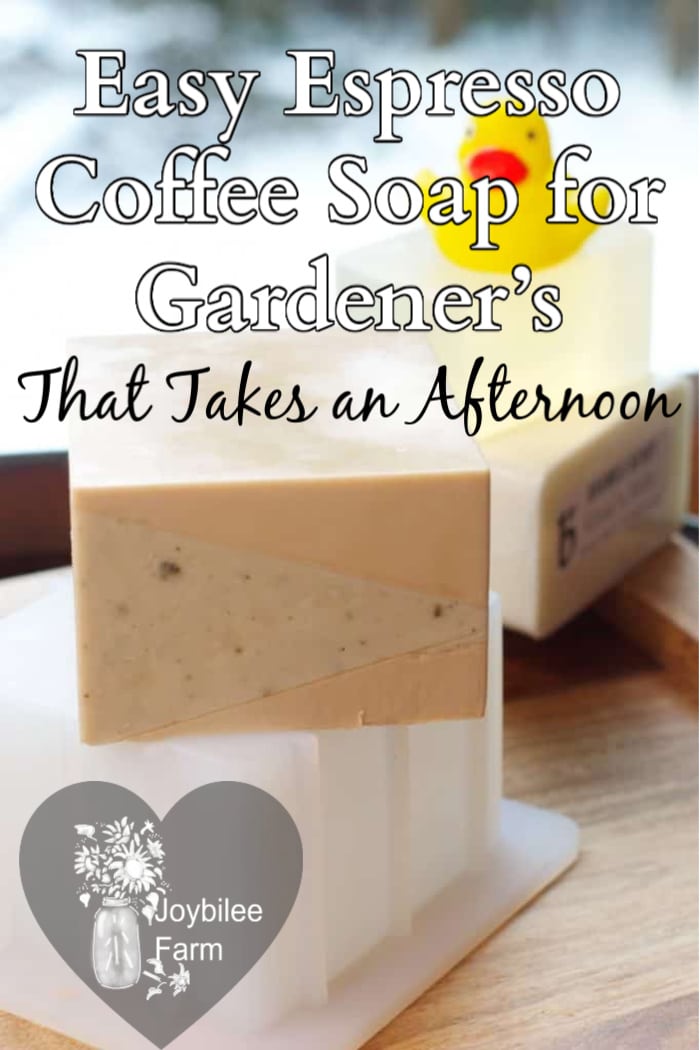 a bar of espresso coffee soap on a stack of glycerin soap base with soap in the background
