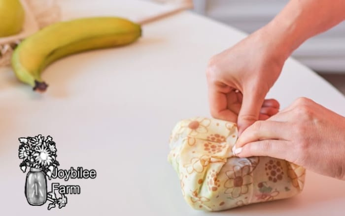 sandwich being wrapped in a beeswax food wrap