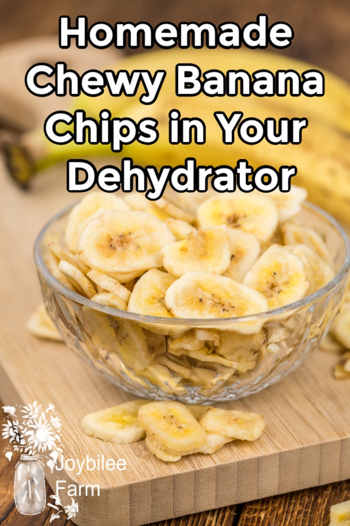 dried banana chips in a crystal bowl on a wooden cutting board
