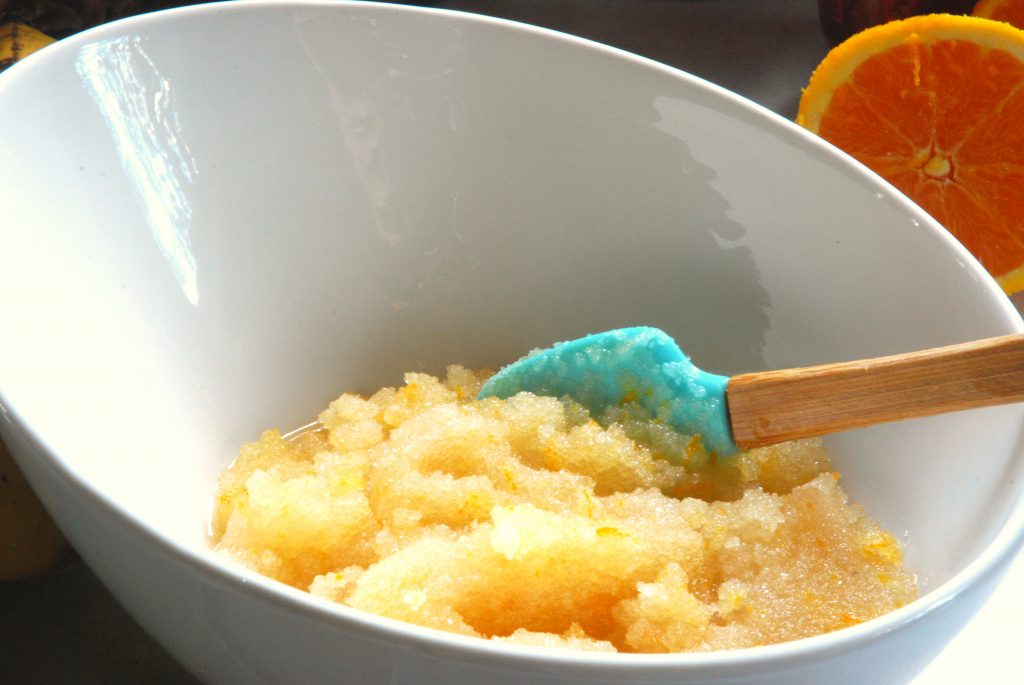 ingredients blended together in a white bowl with a blue spatula